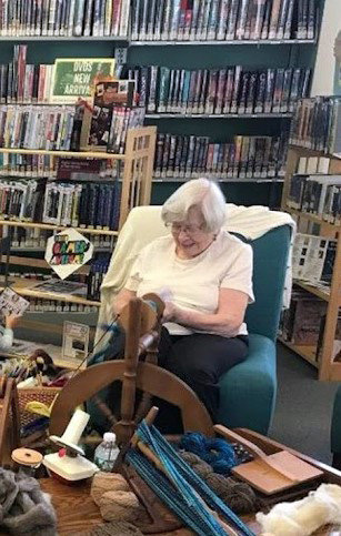 Irma Schilling spins yarn at the Western Sullivan Public Library.